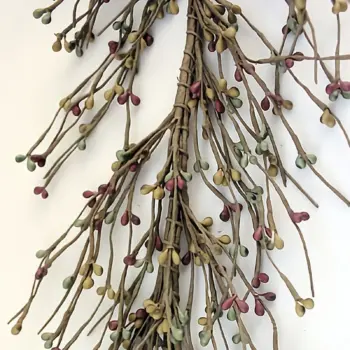 Handmade farmhouse pip berry garland with brick, sage green, and mustard berries for rustic decorating
