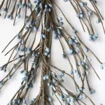 Country blue pip berry garland for primitive farmhouse decorating displayed as rustic home decor accent