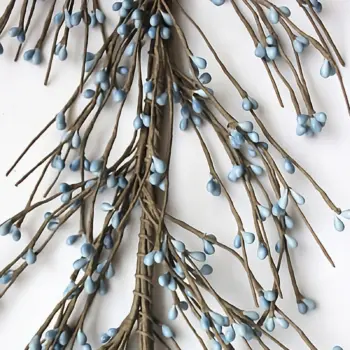 Country blue pip berry garland for primitive farmhouse decorating displayed as rustic home decor accent