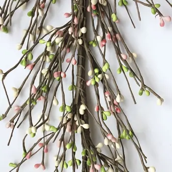 Green, white, and pink pip berry garland styled as primitive farmhouse home décor