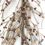 Mustard and burgundy pip berry garland displayed as primitive farmhouse and country home decor