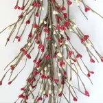 Red and cream pip berry garland with rustic farmhouse styling for seasonal and everyday home decorating.