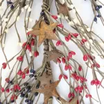 Red white and blue pip berry garland with rustic metal stars for patriotic farmhouse and country home decor