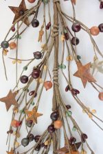 - Green, mustard and burgundy berry with rusty star garland