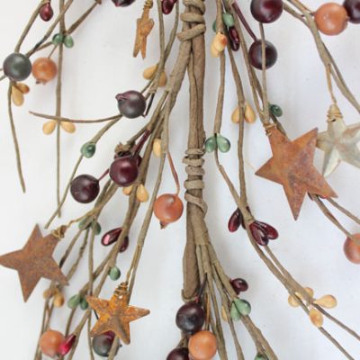 - Green, mustard and burgundy berry with rusty star garland