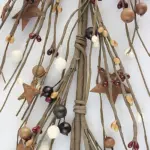 Burgundy cream and mustard pip berry garland with rusty star accents for rustic farmhouse home decor