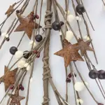 Burgundy and cream pip berry garland with rusty stars for primitive farmhouse, country, and rustic home decor